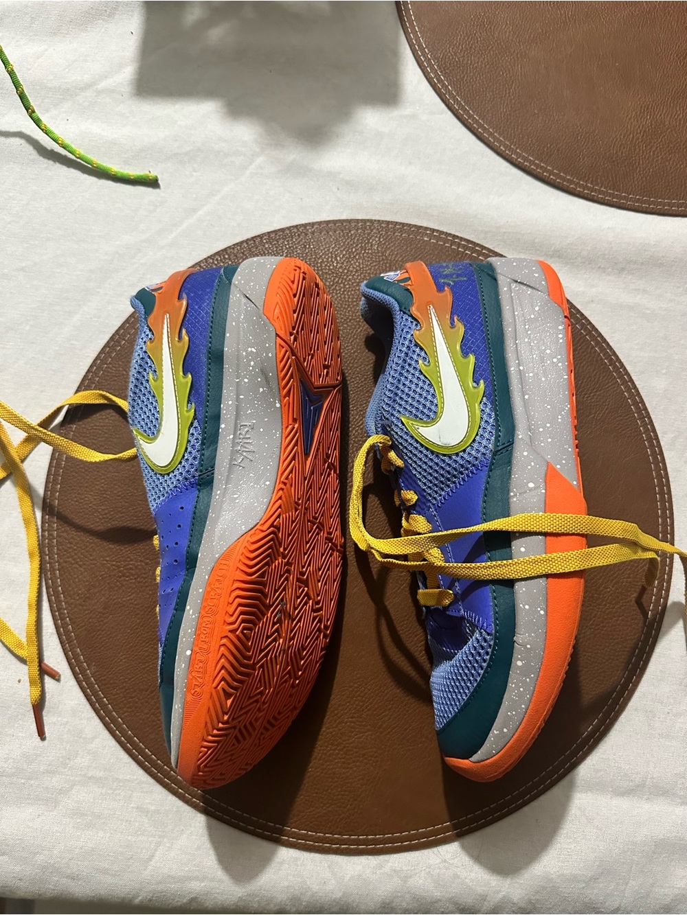 Nike Kids Blue Athletic Sneakers with Orange Soles and Yellow Accents